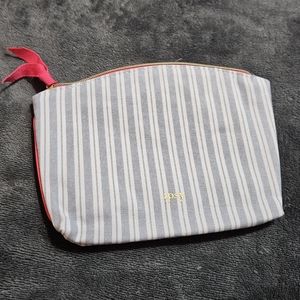 Empty Blue and White Ipsy Small Cosmetics Bag with Red zipper pull
